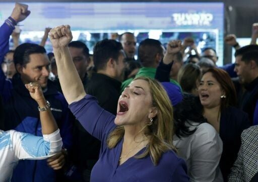 Supporters of Honduran presidential candidate Nasry Asfura celebrate after initial results are announced, putting him in the lead