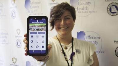 Public information officer Brianne Zwiener with the new mobile app.