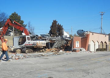 Crews are working to demolish the Magic Carpet and Magre Liquors building in Festus