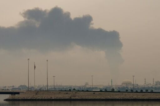 A plume of smoke rises after a reported Iranian strike on fuel tanks in Bahrain