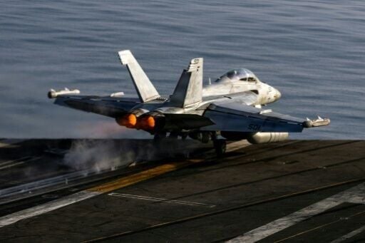 A US EA-18G Growler launches from the flight deck of the aircraft carrier USS Abraham Lincoln