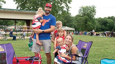 The Diaz family, from left, Norah, 3; Todd; Connor, 9; Theo, 6; Maddie, 1; and Olivia, all from House Springs, gather for the Arnold Independence Day Celebration.