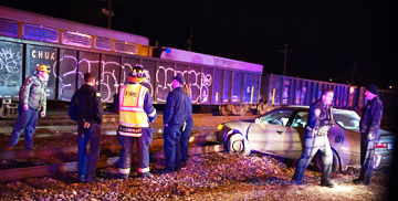 Woman crashes into railroad tracks in De Soto