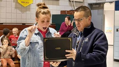 Clyde Hamrick Elementary School second grade teacher Lindsay Gruenewald receives Fox’s teacher of the year award from Superintendent Paul Fregeau.