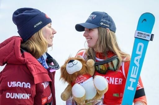 Second-placed Mikaela Shiffrin (L) and winner Switzerland's Camille Rast speak after the World Cup slalom in Kranjska Gora, Slovenia
