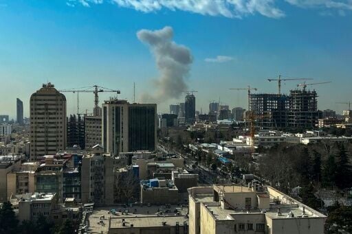 Smoke rose above Tehran after explosions were heard
