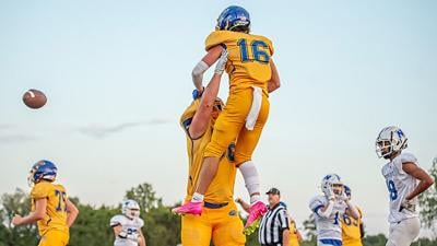 Seckman High School’s Owen Kellick lifts Kade Heinemeier in celebration of Heinemeier’s touchdown Sept. 8 against Northwest.