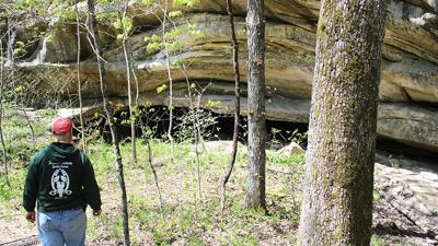 Kress Farm Garden Preserve board chairperson Joe Corio explores the cliff caves.