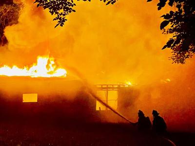 Rock firefighters work to extinguish a blaze that destroyed this home on Ridgecrest Drive in Arnold.