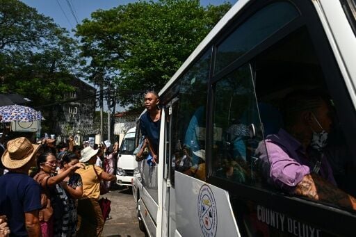 An AFP journalist outside Yangon's Insein Prison saw around 300 prisoners being bussed out of the compound in a convoy