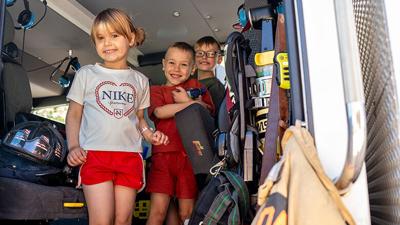 Mia, 4, Edin, 6, and Leonel, 8, Subotic tour a firetruck during the Antonia Fire Protection District’s open house on April 25 at House 2 in Barnhart.