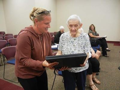 Pevely Mayor Stephanie Haas, left, presents Josephine Astel with a copy of a city proclamation.