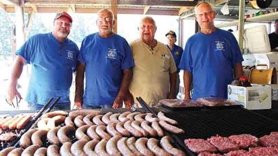 The barbecue crew at the Big River VFW during Cedar Hill Day 2019 from left, Tracy Chaves of Dittmer and Kenny Thebeau, Tom Herek, and Rick Schroeder from Cedar Hill.