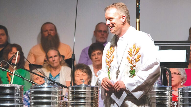 Pastor Jeremy Schultz leads a service at Rickman Auditorium during St. John’s 175th anniversary celebration in May.