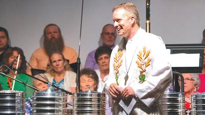 Pastor Jeremy Schultz leads a service at Rickman Auditorium during St. John’s 175th anniversary celebration in May.