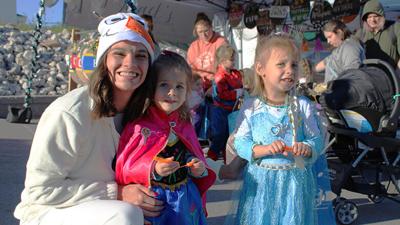 Madi Bonney of Festus, Chevy Roberts, 2, and Amelia Roberts, 3, dressed as “Frozen” characters for the Witches Night in the Ridge event.