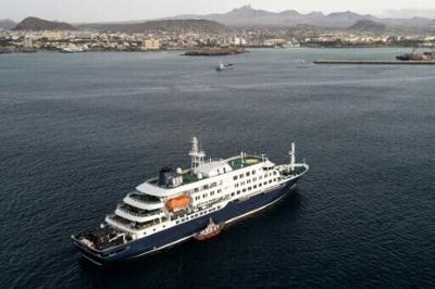 Health personnel board the cruise ship MV Hondius to evacuate infected patients