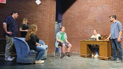 Cast members, from left, Roy S. Bradford, Victoria Avis, Cameron Clark, Isaac Steward, Olivia Hartwell and Skyler Hunt rehearse “A Case of Libel.”