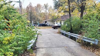 The city of Arnold will purchase two homes at the end of Dudler Drive in order to remove an eroding bridge.