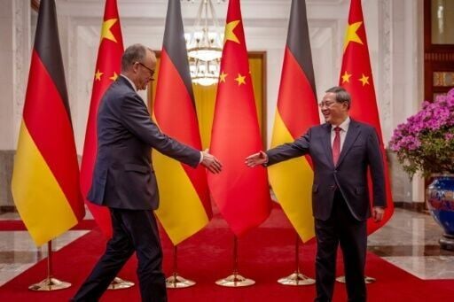 German Chancellor Friedrich Merz is welcomed by China’s Premier Li Qiang at the Great Hall of the People