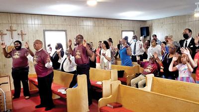 Congregants and guests celebrate the 100-year anniversary of Mount Olive Missionary Baptist Church in Crystal City at a May 7 service.