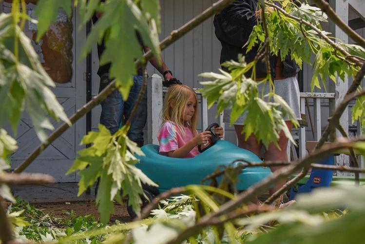 Hadley McMilan, 4, sits in her play car