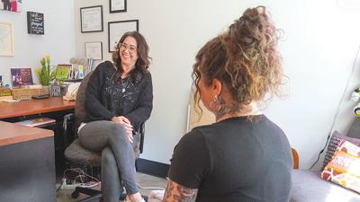 Peer specialist Jenna Gateson, left, offers one-on-one peer support.