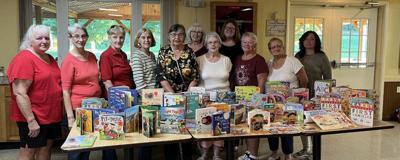 AMVETS Auxiliary donate books to Families R’ Us