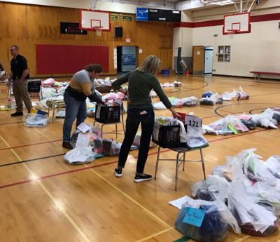 BMC employees organize student supplies