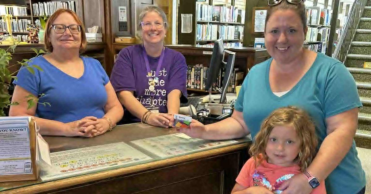 Local library card travels well; on display at a Long Island library ...