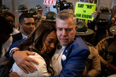 Rep. Jason Powell (D-Nashville) hugs a tearful Sen. London Lamar (D-Memphis) in the state Capitol, May 7, 2026.