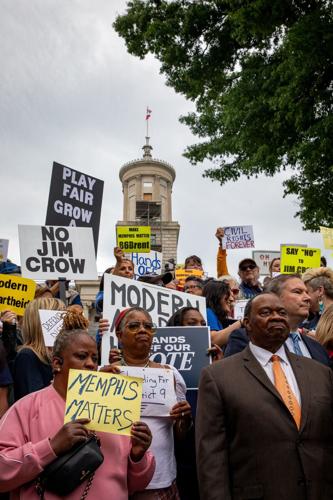 Protesters and elected officials rally outside the state Capitol, May 5, 2026