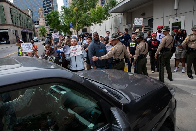 Members of the Tennessee Highway Patrol hold back protesters attempting to block lawmakers' entrance to the state Capitol, May 5, 2026