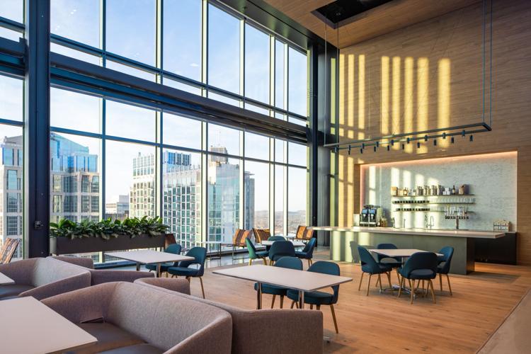 Employees socialize and enjoy locally-sourced food & beverage options on the 24th floor café.jpg