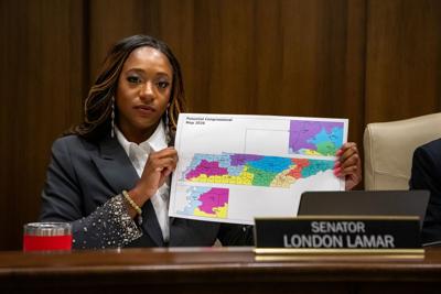Sen. London Lamar holds a copy of Republicans' proposed congressional map, May 6, 2026