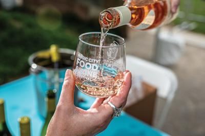 Pouring rosé into a glass at the Music City Food and Wine Festival, the Nashville Scene’s 2026 Best Food Event in Nashville