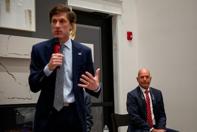 Charlie Hatcher (right) listens to remarks from his opponent, Columbia Mayor Chaz Molder, during a forum in Spring Hill, Oct. 21, 2026