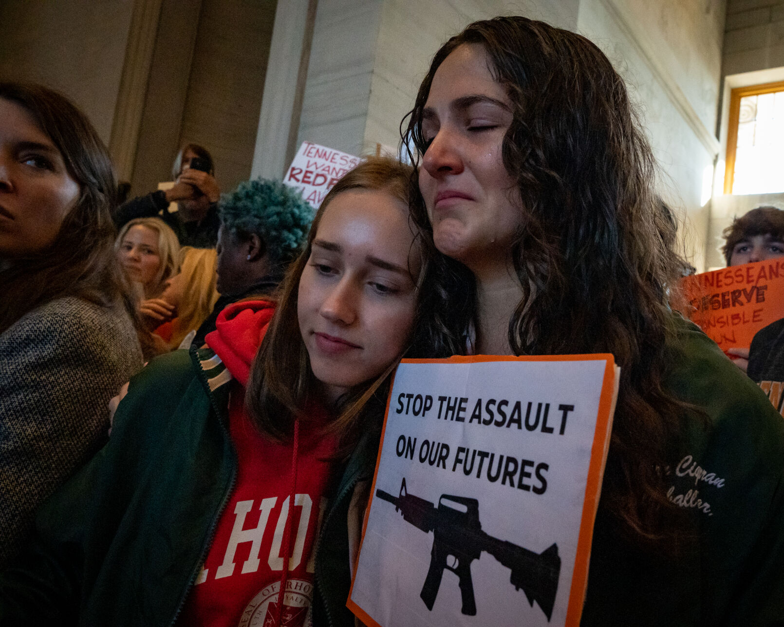 Sarah Braam (left) and Davern Cigarran, both 17-year-old juniors at Nashville’s Harpeth Hall School, embrace during a gun control protest at the state Capitol, March 30, 2023