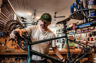 man working on a bicycle at Shelby Ave. Bicycle Co., the Nashville Scene’s 2026 Best Bicycle Shop in Nashville
