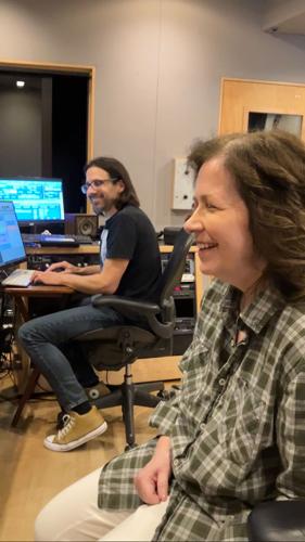 Musician April McLean and audio engineer Charles Yingling in the studio, listening to playback