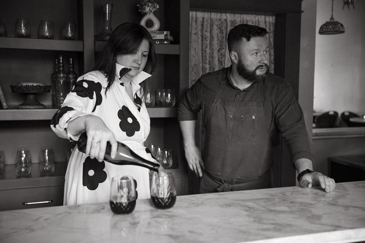 black and white photo of owner Lauren Maranto and Luke Williams at Antoinette’s Wine + Provisions in Sylvan Park