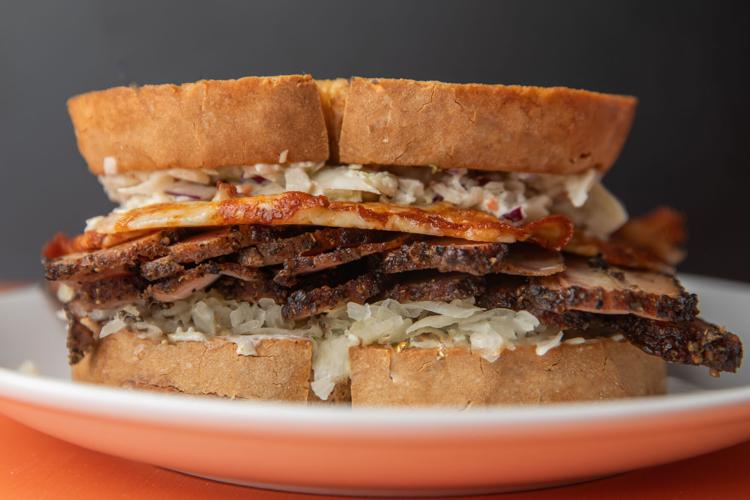 A ruben sandwich made with generous slices of brikset between two thick slice of bread