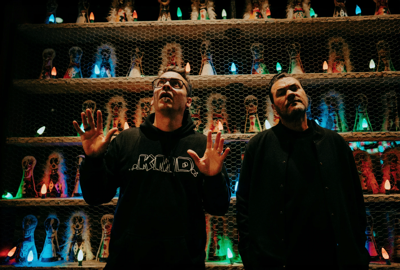The members of Minneapolis rap duo Atmosphere pose in front of stylized bowling pins at Brooklyn Bowl
