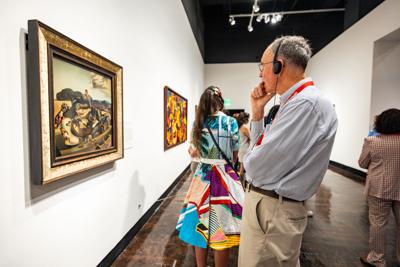 A Frist visitor looks at Salvador Dalí's 'Autumnal Cannibalism'