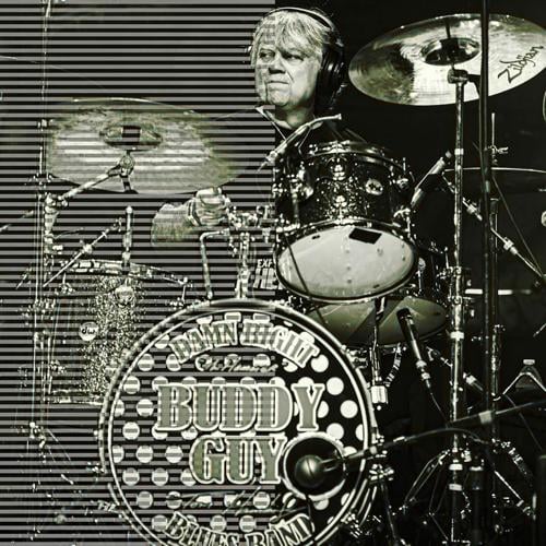 Tom Hambridge onstage performing with Buddy Guy