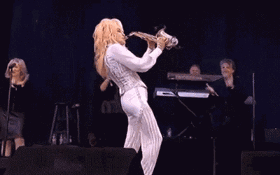 Here's Dolly Parton Playing 'Yakety Sax' at Glastonbury