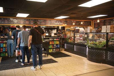 People standing in line at 51st Deli