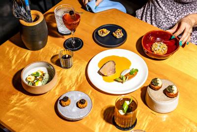 A delicious-looking spread of food laid out on a table at Bastion