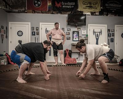 Zachary Sparkman and Gabriel Tolentino prepare to wrestle at Tennessee Sumo Association