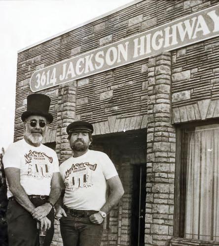 Jerry Wexler and Willie Nelson standing outside Muscle Shoals Sound Studio